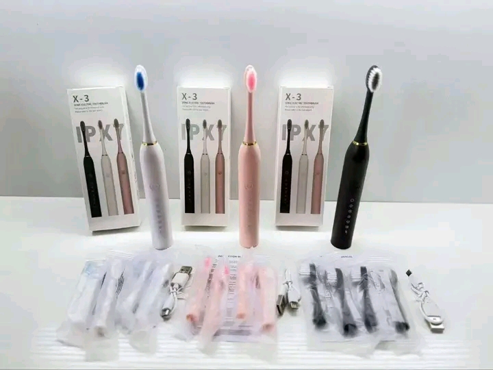 Electric toothbrush with three extra brush
